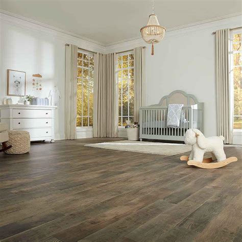 Granby Scraped Hickory's classic design with warm amber color is enhanced by dark character marks. . Pergo defense sun veiled oak